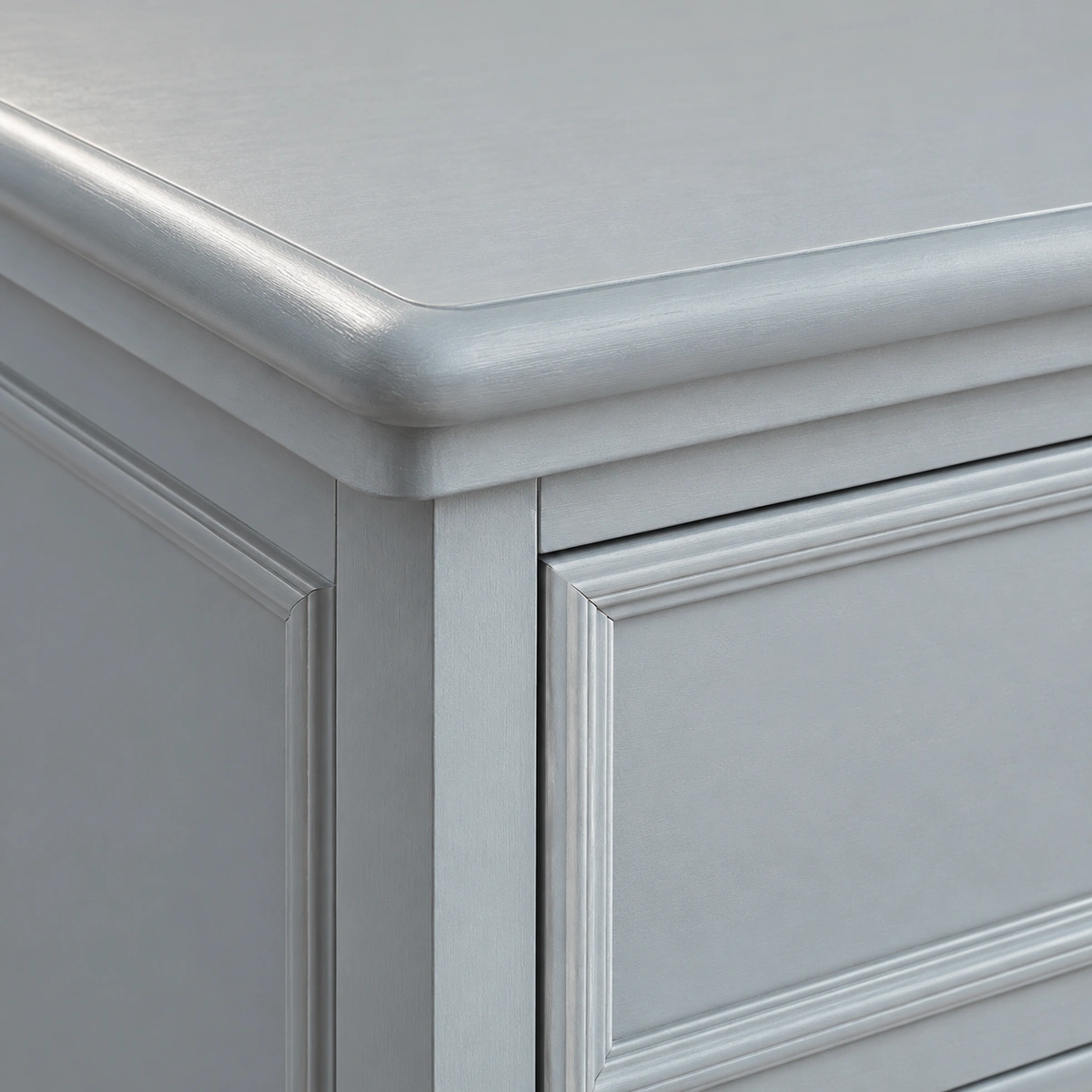 Angle du plateau arrondi et montant gris de la commode Club
