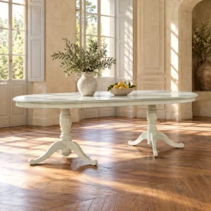 Table ovale ivoire à double socle dans une salle lumineuse