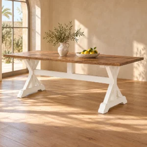 Table rectangulaire croisée bois et blanc dans une salle lumineuse